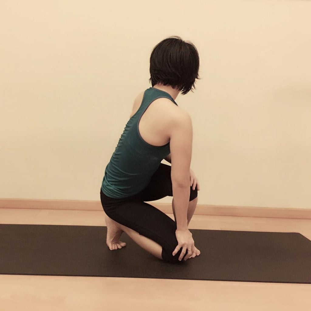 Udarakarshanasana | Abdominal Twist Pose - 101YogaStudio